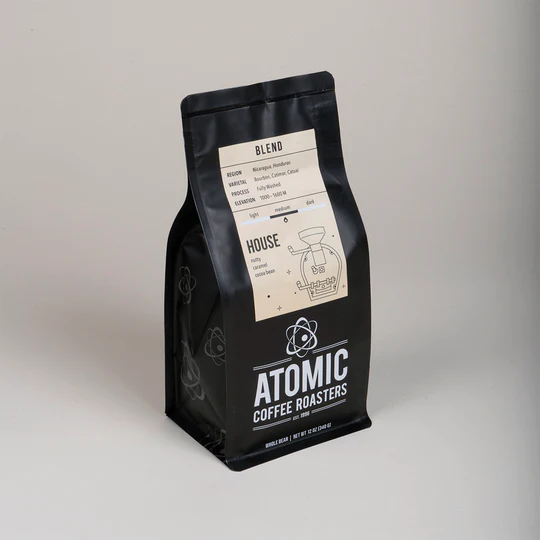 A bag of Atomic Coffee Roaster Beans titled "House Blend"